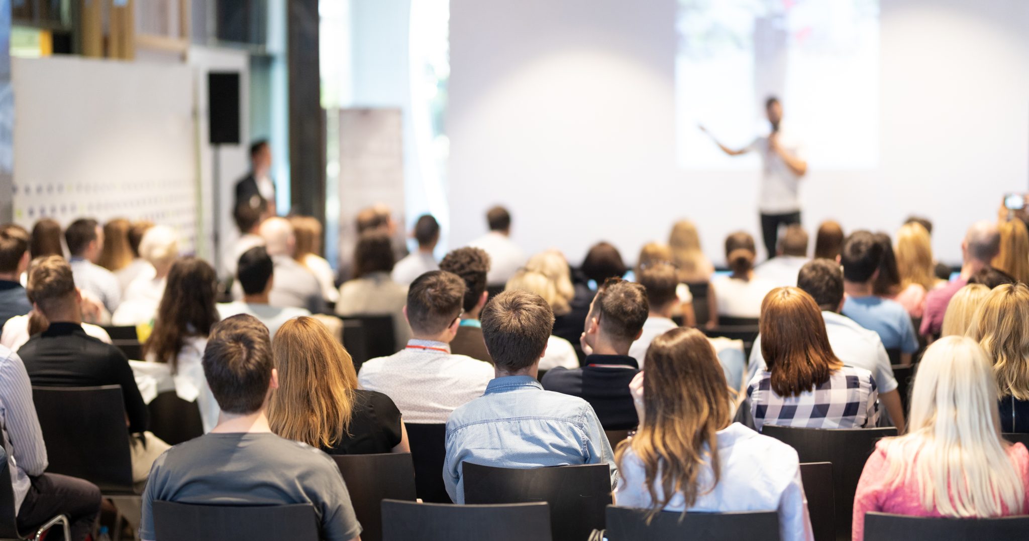 One man speaking at a conference